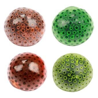 Purista palloa, jossa on vettä täynnä olevia helmet, alien-munan kanssa.